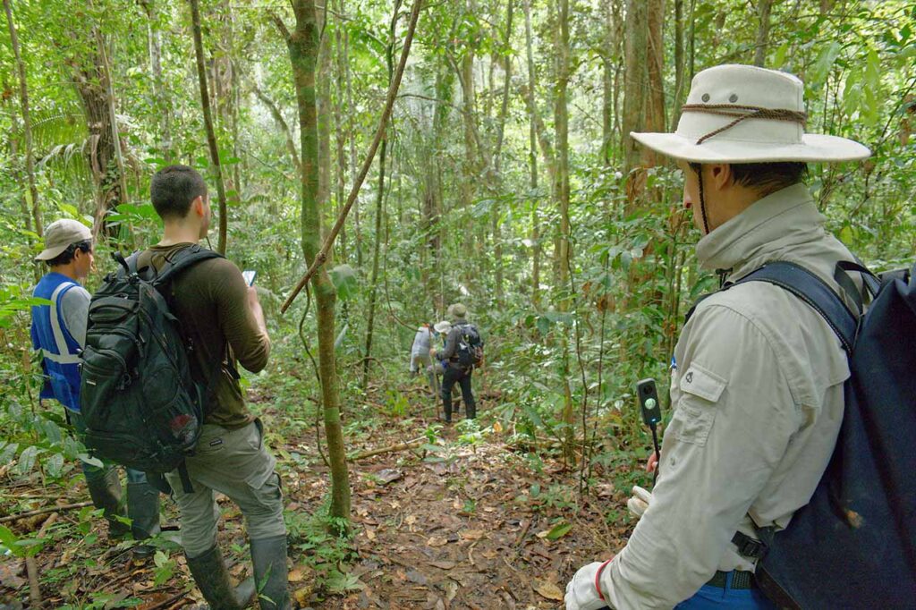 Fund the Planet team members working inside the Amazon Rainforest in Peru.